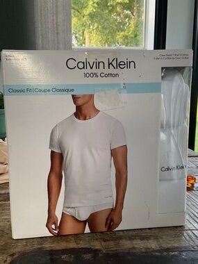 Calvin Klein white tee shirts,new in box.L.
